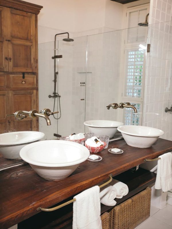 Colonial bathroom featuring twin basins in the Heron room at Amarla