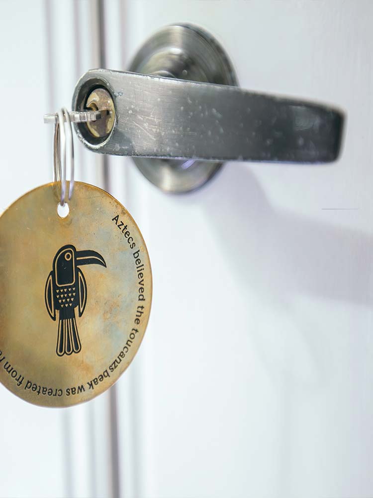 Message on Toucan bedroom brass round keyring at Amarla Boutique Hotel in Cartagena