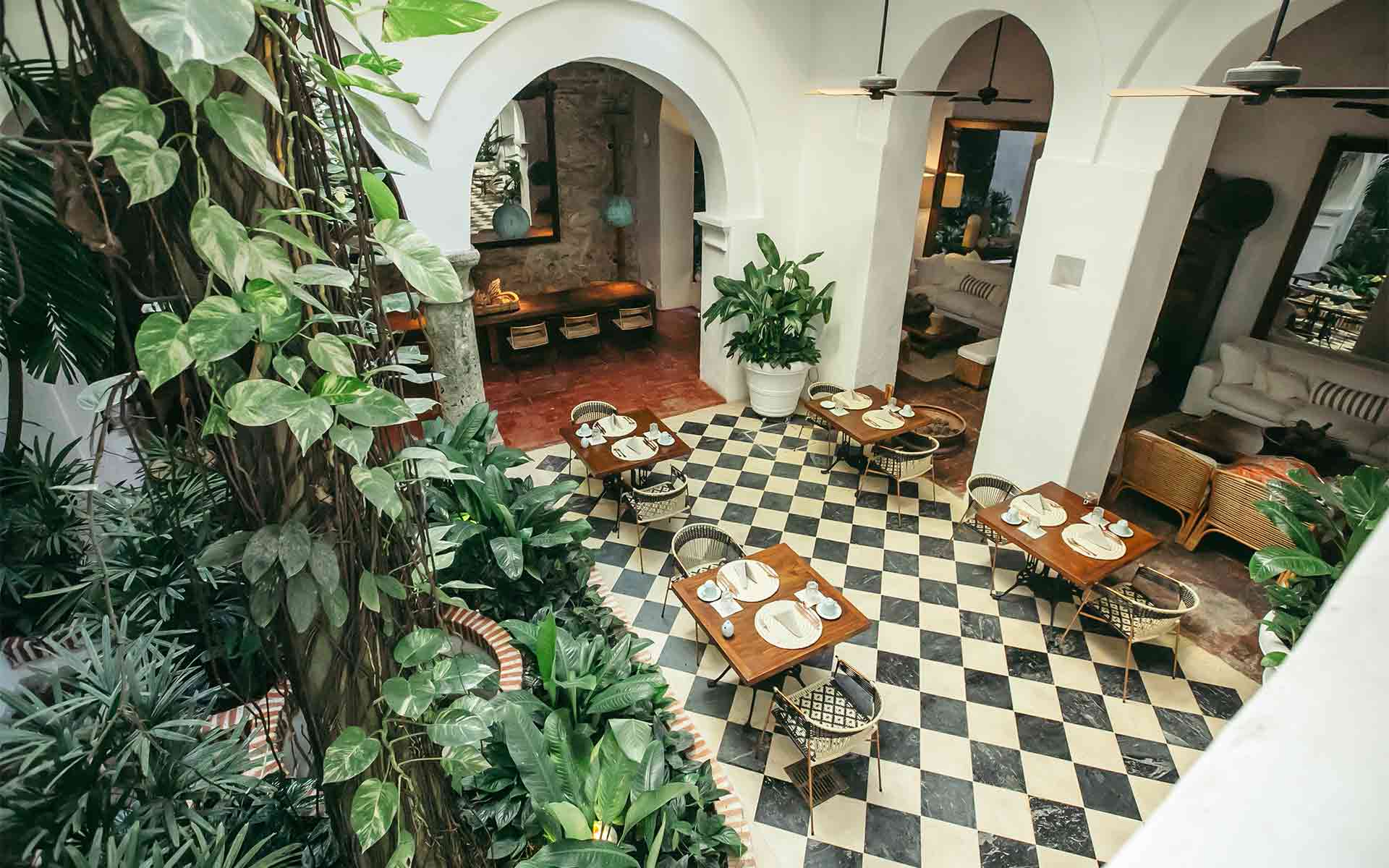 View from the balcony overlooking the central courtyard of Amarla Boutique Hotel in Cartagena Colombia, where breakfast, dining and functions take place 