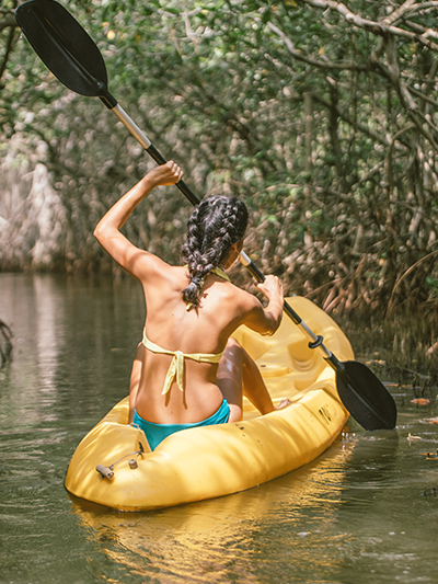 Kayaking through the mangroves near the enchanted lagoon is one of the amazing things to do in Cartagena